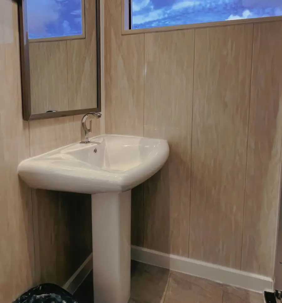 A simple and clean bathroom at Crystal Resort, an overwater resort in the Semporna Islands area